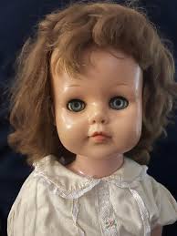 Identifying and repairing a vintage walking doll?