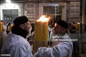 Two devotees wearing the traditional white 'sacco' and a black velvet...  News Photo