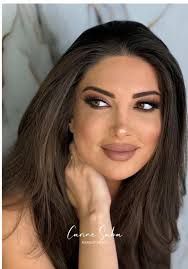 Admiring Glam Makeup Highlighting Natural Beauty