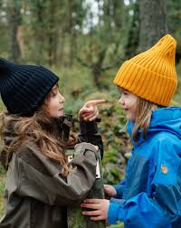 Black And Yellow Outfits For Kids Girl Friends Having Fun Goofy In The Forest Kids Black And Yellow Wool Beanie Look Outdoor Outfits For Kids Hips Toddler Outfits Girl Outfits Outdoor Outfit