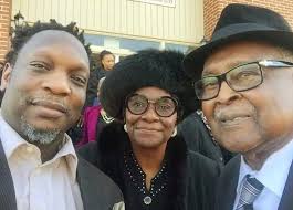 Bishop Henry Dillard, State Elder Rudene Dillard and grandson KD.