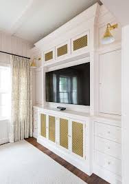 2 of our family installers. Master Bedroom Built In Tv Cabinetry With Brass Grills Transitional Living Room