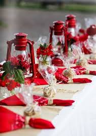 Plates in red with bright silver cutlery and glasses make for a striking appearance. Christmas Table Decoration Ideas Handspire