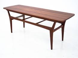 Characterised by a brushed brass and bronze drawn tubes structure. Danish Teak Coffee Table 1960s 145472