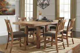 The rest of the table as well as the chairs are in a rusticated white wood, placed at the center of the room over a rope area rug. 10 Dining Room Decorating Ideas To Create Your Style Ashley Homestore