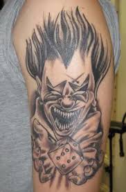 Grey ink evil clown jester tattoo design. 9 Laughing And Creepy Clown Tattoo Designs Styles At Life