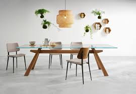 Wood dining room table sets are hefty and durable, however, ensure that your tabletop is sealed so moisture and liquid does not damage the precious wood. Dining Table With Wooden Structure And Top Made Of Glass Idfdesign