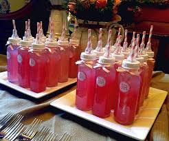 Fun And Creative Way To Serve Beverages On A Baby Shower Party Baby Shower Bottle Diy Baby Shower Decorations Baby Shower Drinks