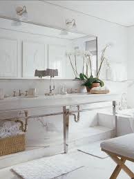 Metal Console Sink Ideas On Foter Glamorous vanity console featuring sleek angular tapered legs of glossy metal and a long rectangular white top with 2 small sinks.