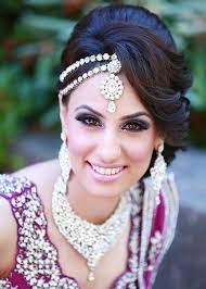Soft curls and one big studded hairclip to tuck one side behind your ear. 16 Glamorous Indian Wedding Hairstyles Pretty Designs