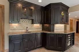 Belt sanders work great for making distressed cabinets. Inset Doors With Black Painted Amp Distressed Finish Cultivate Com Distressed Kitchen Cabinets Distressed Kitchen Black Kitchen Cabinets