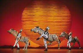 Image result for picture of broadway show of Lion King