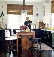 A Mismatched Kitchen Island Stands Out From The Discreet Cabinetry Matchstick Shades Tie The Wooden Island A Kitchen Inspirations Home Kitchens Black Kitchens