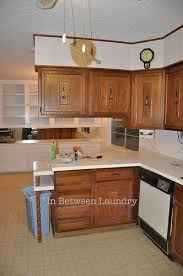 In Between Laundry Kitchen Cabinets Makeover Part 1 Redo Kitchen Cabinets Kitchen Cabinets Makeover Kitchen Redo