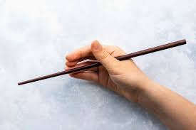Tip successful chopstick use depends on stabilizing this bottom chopstick, which doesn't move, to leave your thumb and forefinger free to maneuver the top chopstick, which does. How To Use Chopsticks