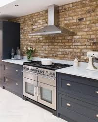 Stunning Exposed Brickwork Highlights The Range And Beautiful After Midnight Shaker Kitchen Company Cabinetr Brick Wall Kitchen Kitchen Layout Kitchen Interior