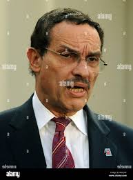 Washington Mayor-Elect Vince Gray, center, talks as his nominee for Police  Chief Cathy Lanier, left, and Deputy Mayor for Public Safety and Justice  Paul A. Quander, Jr., right, look on. Thursday, Dec