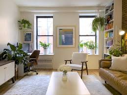A Small Nyc Apartment Has The Cutest Simple Plant Display Above The Bed Tiny Living Rooms Minimal Living Room Desk In Living Room