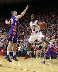 Indiana Hoosiers Guard Yogi Ferrell 11 Passes The Ball With Evansville Purple Aces Adam Wing 12 Indiana Hoosiers Basketball Iu Hoosiers Hoosiers Basketball