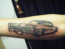 Black custom hot rod with flames. Grey Ink Old Car Tattoo On Arm