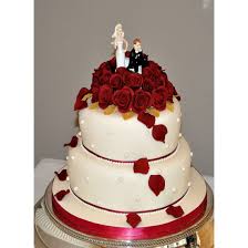 Make this cream cheese frosting to go with a delicious red velvet cake. Red Velvet Red Velvet Wedding Cake Decorated With Red Sugar Roses