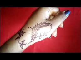 You will get confused at first seen on this tattoo. Infinity Tattoo Ideas Infinity Feather Tattoo With Birds On Hand For Girls Boys Fashion Wing Youtube