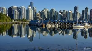 Vancouver skyline on false creek and illuminated bc place stadium at night in british columbia. Vancouver Skyline Canada