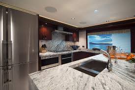 Another contemporary kitchen design, this kitchen uses modular cabinets with laminated finish for a cleaner, more uniform look. Yacht Galley Design Yacht Interiors Ft Lauderdale Florida