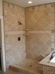 The flooring is 12x12 terrazzo tiles that work perfectly off the blue glass 6x12 tile on the back wall. Travertine Accent Tiles Shower Wall Tile Bathroom Remodel Shower Travertine Shower