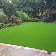 Start by laying down some boards. Artificial Grass Everything You Need To Know Costs And Laying A Faux Lawn