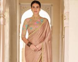Image of Beige saree with heavy embellishment