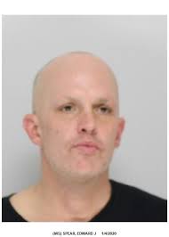 Man charged with flashing knife at salon