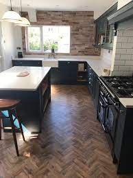 Painted Shaker Kitchen In Marine Blue With Calacatta Tops By Inspirational Interiors Uk Parquet Flooring Kitchen Brick Wall Kitchen Parquet Flooring