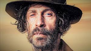 Tim Blake Nelson plays an awesome role in this Western watched it last  night, 90 minute movie gave it a shot I was not disappointed.