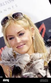 Sharon Stone poses for the photographers with 2005 winners Kelly Reilly and  Jonathan Rhys Meyers during the Chopard Trophy Party in Cannes