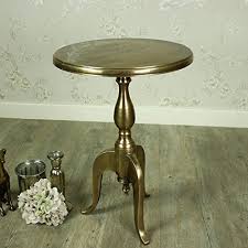 A modern end table will have a minimal design with geometric shapes in neutral color tones. Gold Round Metal Pedestal Side Table Buy Online In Andorra At Andorra Desertcart Com Productid 55288417
