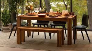 Its broad top accommodates a bounty of platters and bowls, and two aproned leaves extend it to seat a crowd. Harvest Bench Dining Table With Bench Eq3 Canada