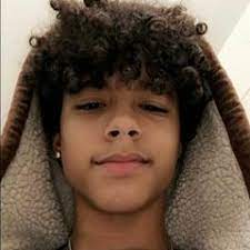 Cute twist hairstyle ↓ 14. Image May Contain 1 Person Closeup Boys Haircuts Curly Hair Dark Skin Boys Boys With Curly Hair
