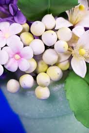 The balanced tones of these flowers allow the focus to be placed on the focal flowers. Filler Flowers Gumpaste Stephanotis Lemon Blossom Berries And Lilac