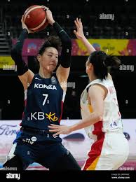 China's Wang Siyu, right, attempts to block South Korea's Park Jisu during  their Women's Basketball Asia Cup game in Sydney, Australia, Wednesday,  June 28, 2023. (AP Photo/Mark Baker Stock Photo