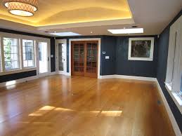 If you're bored by a plain boxy room, take heart. Tray Ceiling With Led Cove Lighting Leather Finish Walls Cherry Doors Floor Transitional Family Room Providence By Modern Yankee Builders Houzz