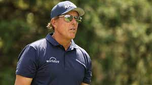 I'm wearing a coral colored dress, sun hat & sunglasses. Mickelson Leads With Shades And Gum Where You At Bryson
