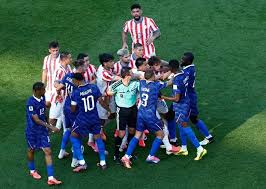 Coach Deschamps criticized Paraguay's tactics and praised Morocco.