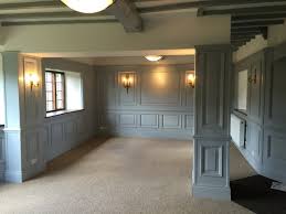 This living room layout relies on the unconventional use of a deep blue color on the walls, highlighted and accented by bold, ornate. Living Room Wall Panels Living Room Mdf Wall Panelling Wall Panelling For Living Areas