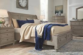 Roomy drawers, including two in the footboard of the bed, keep everything organized in style. The Lettner Light Gray 7 Pc Dresser Mirror Queen Sleigh Bed With Storage 2 Nightstands Available At Dayton Discount Furniture Serving Vandalia Kettering And Springfield Ohio