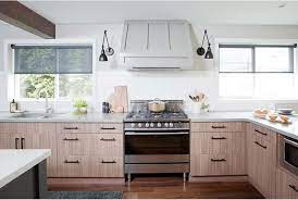 Custom wood hood with pull out spice racks, mantel, motif, and corbels; 15 Range Hood Design Ideas That Are Anything But Eyesores