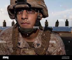 U.S. Marine Corps Cpl. Ryan Pagel, left, network administrator, and Cpl.  Drake Robison, data systems administrator, both with 3d Supply Bn,  configure a network during a field training exercise
