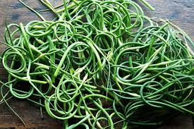 What To Do With An Overload Of Garlic Scapes Garlic Scapes Scape Recipe Easy Vegetables To Grow