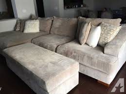 A large fluffy sectional with oversized ottoman is a comfortable footrest for someone sitting nearby. Pin On Small Apartment