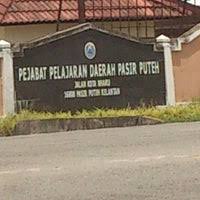 There are many big stores all along the street. Majlis Daerah Pasir Puteh Capitol Building